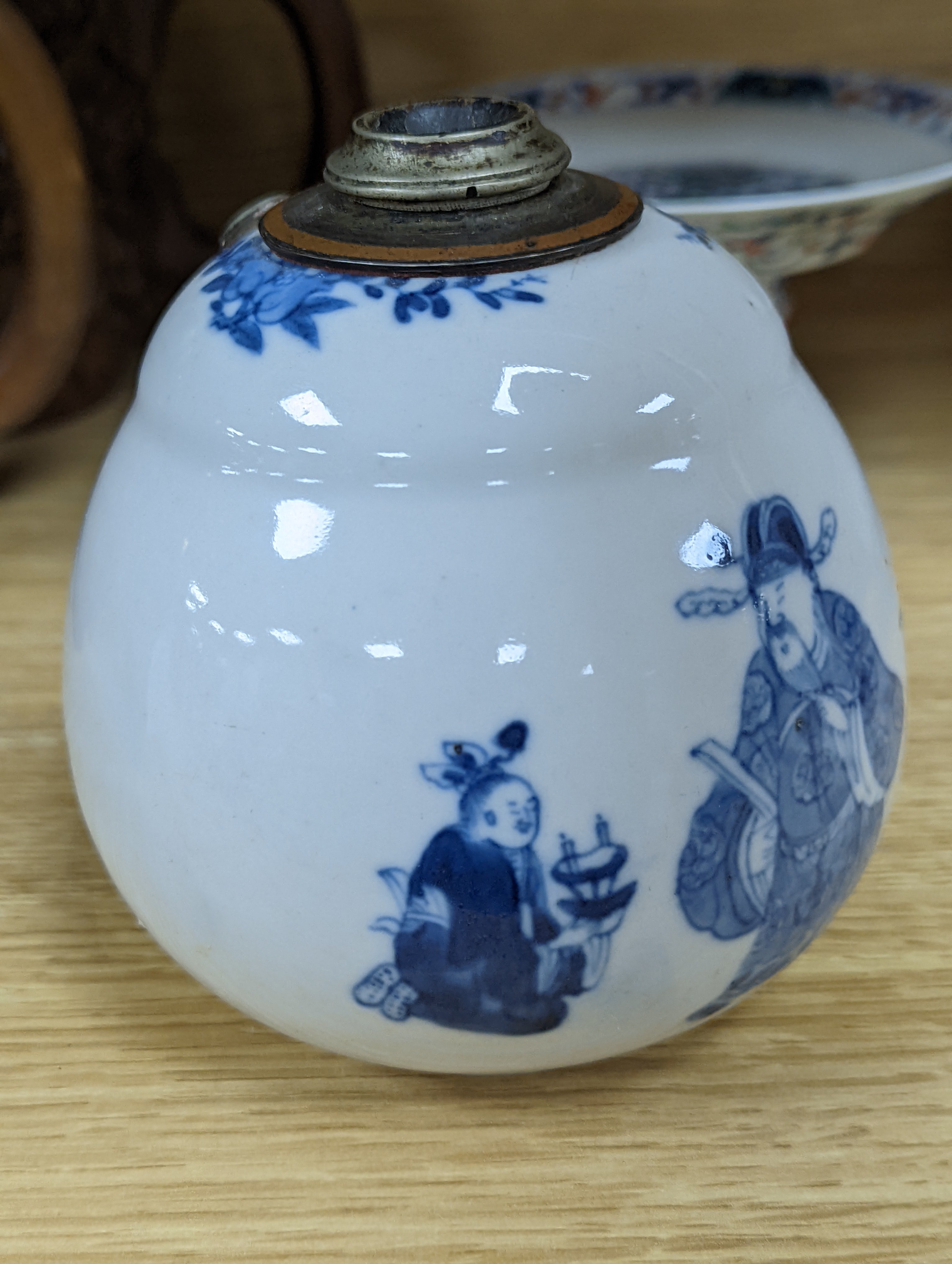 A Chinese blue and white water pipe vessel, a doucai stem dish and a Japanese Imari bowl, 19th century, (3)